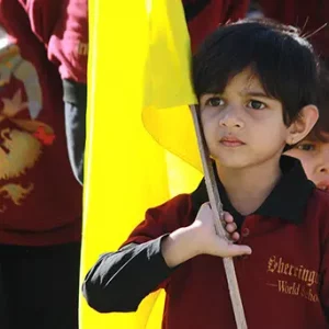 Junior KG kid holding flag