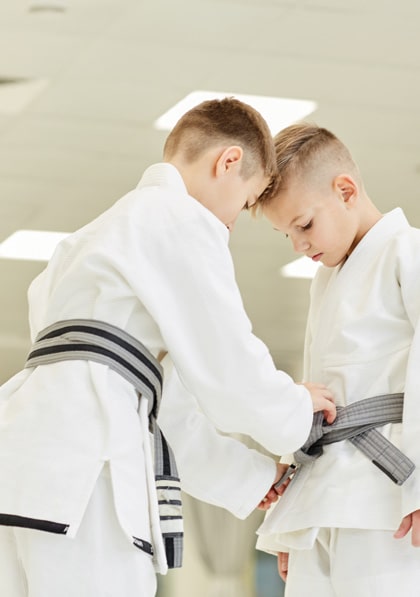 boys-preparing-for-training-in-karate-2021-08-27-22-39-39-utc